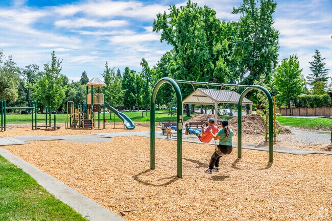 The swings and playground are welcoming to the kids near Meadow Oaks.