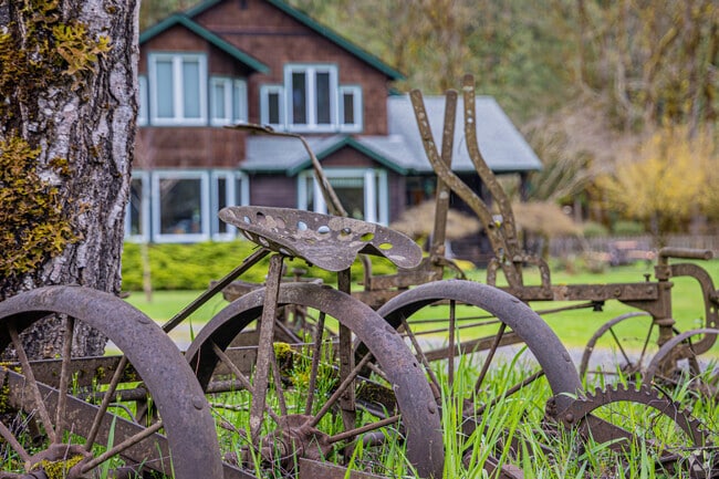 Large lots are common, and features may include pastures, gardens, fruit trees and outbuildings.