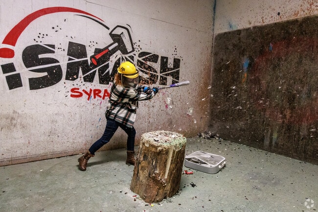 Residents can smash some bottles with a baseball bat at iSmash Syracuse in the Westvale Plaza near Winkworth.