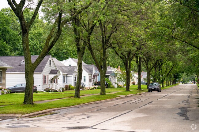 Large oak trees line the streets in the Marquette Park community of Green Bay, WI.