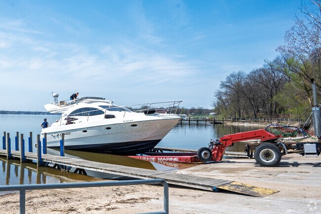 A boat enters Lake Macatawa at the Dunton Park boat launch in Beechwood.