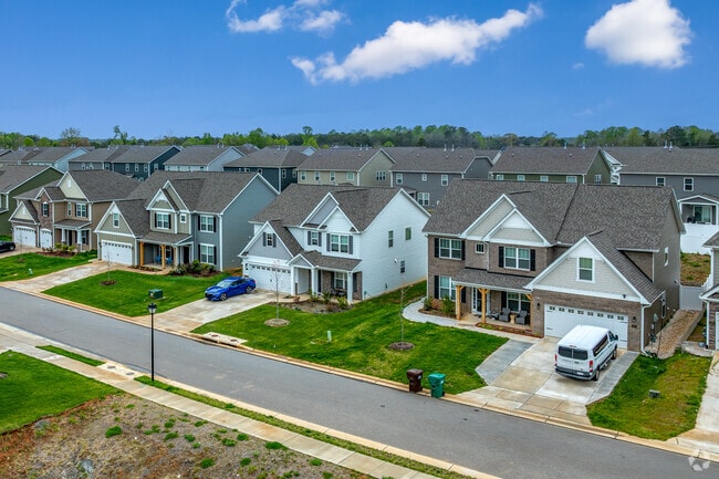 Deep River blends older homes with new builds in a quiet, tree-lined suburban setting.