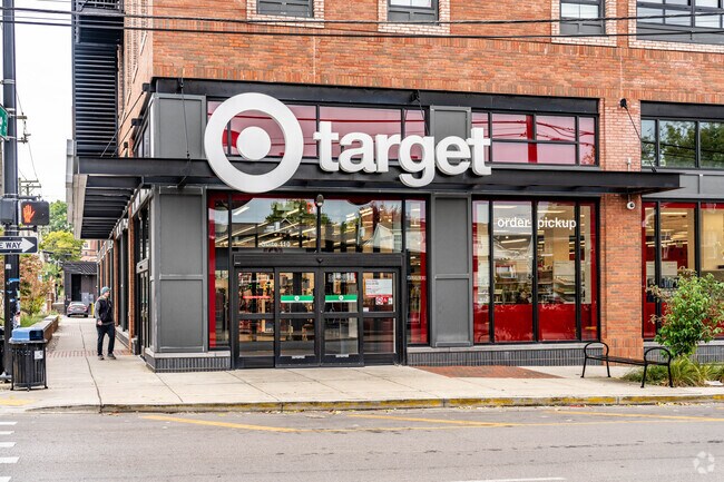 A person walking into Target Grocery in the Historic Western Suburb