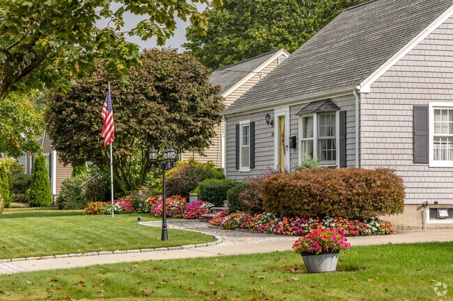 These colorful gardens in this row of homes in the Buttonwoods neighborhood shows civic pride.