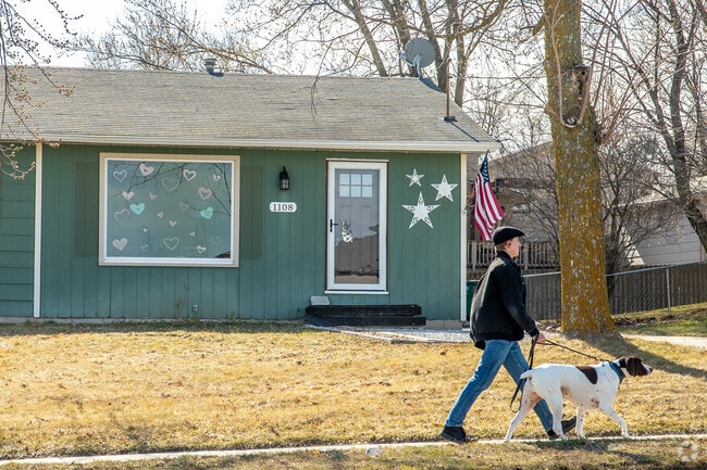 Pet owners enjoy peaceful walks on Polk City’s quiet, shaded streets.