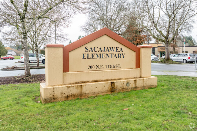 Sacajawea Elementary School orange concrete sign in Vancouver, WA.