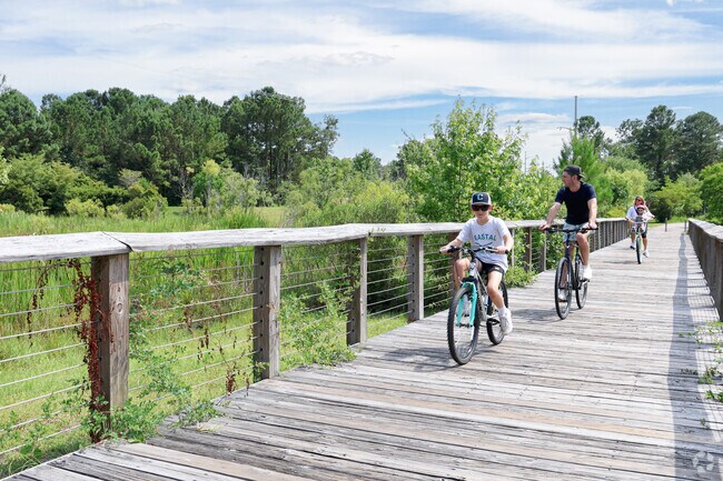 Wade Park connects to the Cross City Trail via wooden bridges.