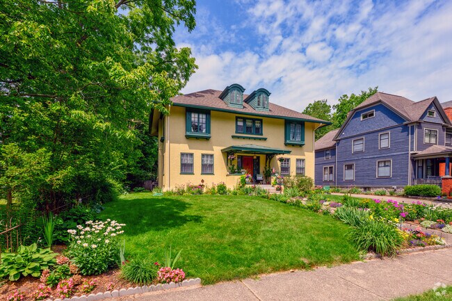 The blooming summer flowers enhance the beauty of this Georgian-style home, in Stuart.
