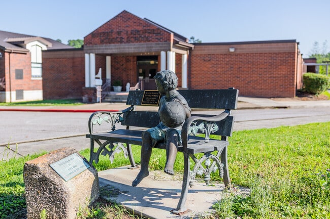 A statue welcomes students to Langford Middle School in Augusta.