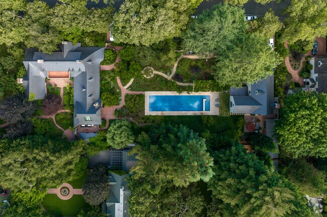 Luxurious homes are surrounded by trees and perfectly landscaped yards.