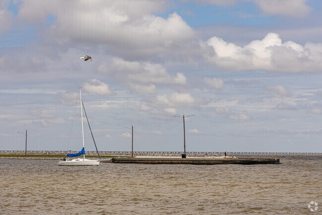 Sailboat rounds The Point on Lake Pontchartrain near West End’s municipal harbor.
