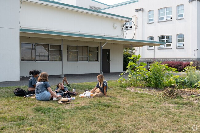 Whatcom Middle School offers a garden and grassy area where people can relax.