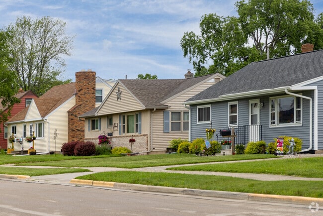 Charming rows of Minimal Traditional homes reflect mid-century character in Fox Crossing.
