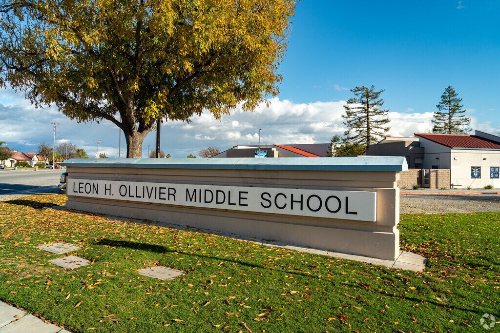The sign at Leon H. Olliveir Middle School welcomes staff and students as they enter the school.