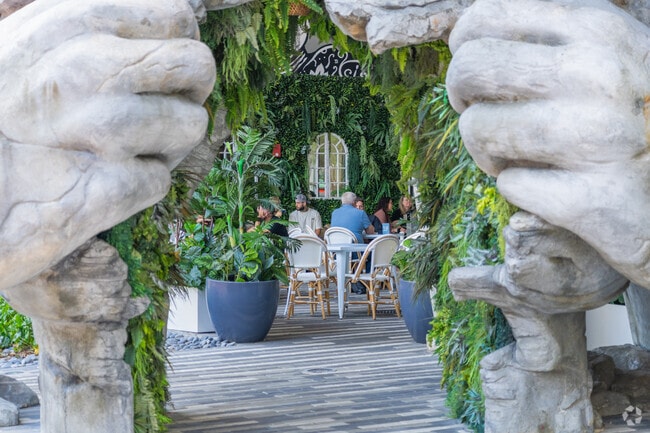 Savor delectable cuisine at Pura Vida Restaurant, conveniently located near Dillard Park.