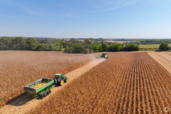 Tractors move through La Fox fields during the fall harvest season.