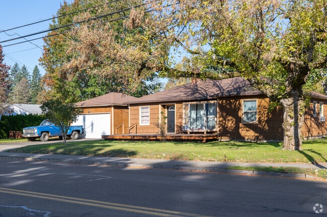 A classic truck sits in front of a home on C St in Downtown Washougal.