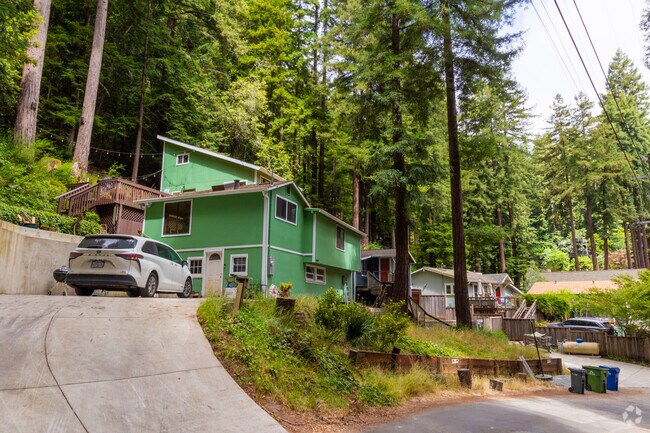 Homes are built into the mountainous terrain of Lompico.