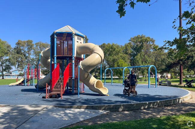 Bringing the kids to the playground among the trees at Huntington Central Park.