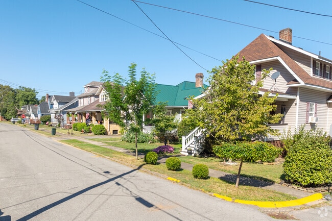 Neat landscaping adds charm to a Weston home.