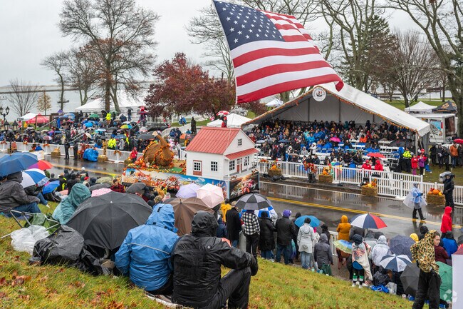 Thousands of people line the streets of Plymouth Center for the Thanksgiving Parade.