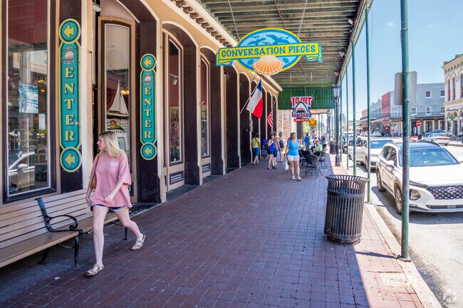 Enjoy the island sunshine along the storefronts of The Strand, near East End Historic District.