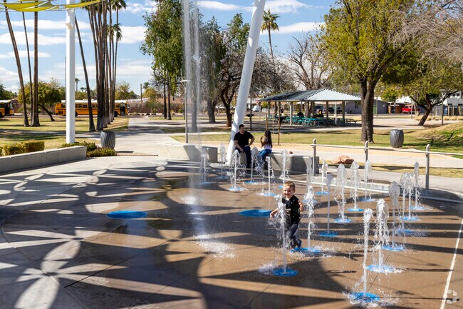 Cool off during the warmer months at the splashpad in Pioneer Park in Mesa.