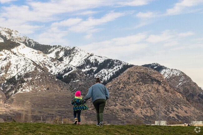 A mother and daughter enjoy mountain views at Orton/Green Acres Park in Harrisville.
