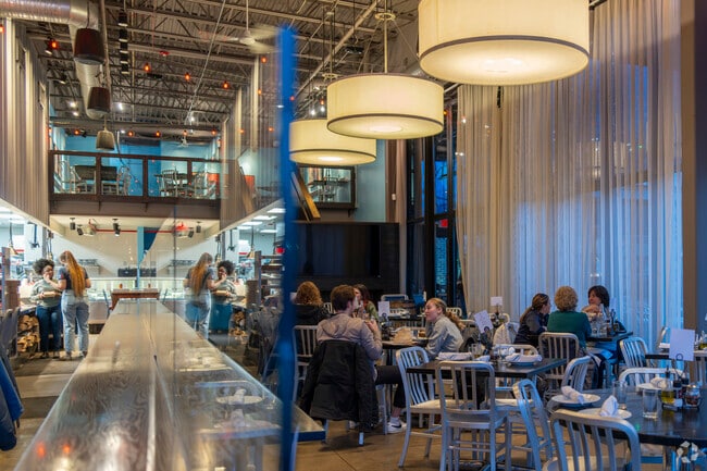 Locals of Tuomy Hills enjoy pizza from Bigalora Wood Fired Cucina.