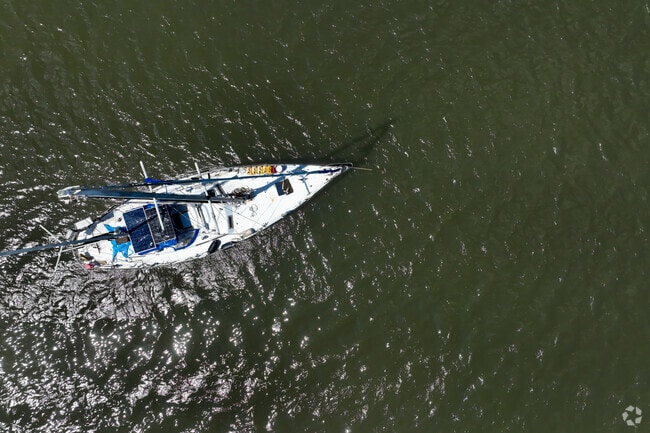 Spend some time sunbathing on a sailboat in Paradise Beach.
