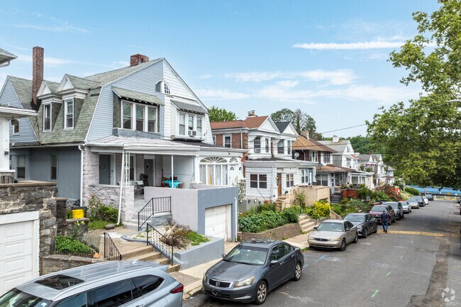 Some duplex homes in Millbourne have gambrel roofs reminiscent of the Swedish Colonial style.