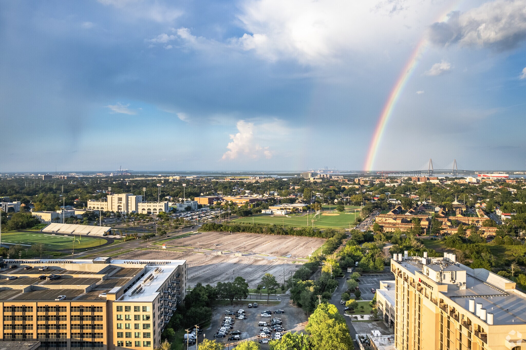 The Westside neighborhood shines in a colorful light with a rainbow overhead.