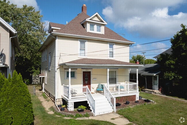 This beautiful American Foursquare home is basking in the summer sun.