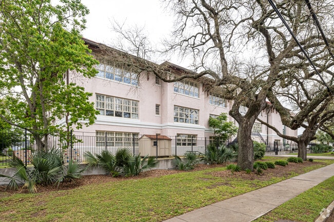 Andrew Wilson Charter School is surrounded by large oak trees.