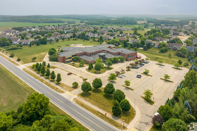 A wide aerial image showing Arboretum Elementary School, including the parking lot.