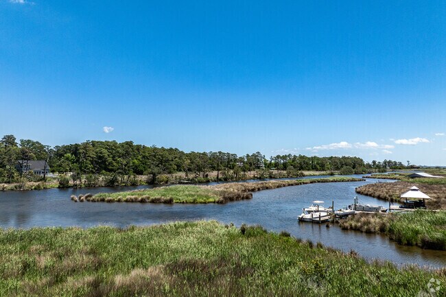 Homes in Colington Harbour are built on stilts to mitigate flood risks from the surrounding sounds.