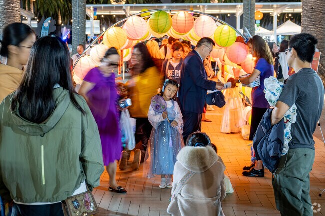 Children of all ages love getting their picture taken under the multi-colored lantern tunnel at the Mid-Autumn Festival in Irvine.