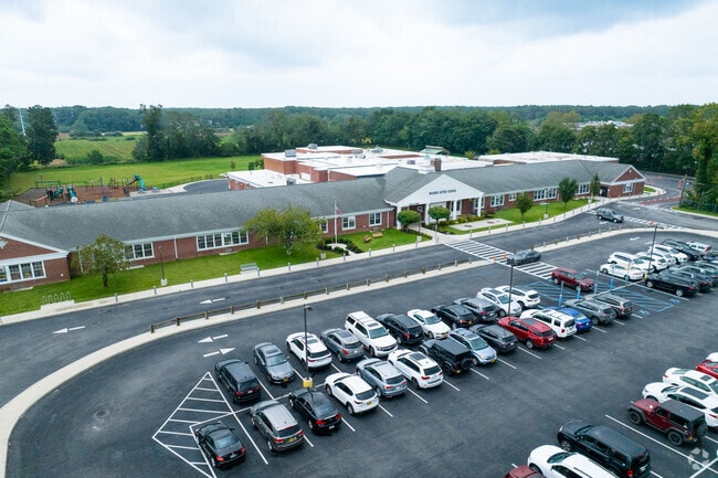NID 537930 Wading River School is located right off Route 25a near a commercial district.