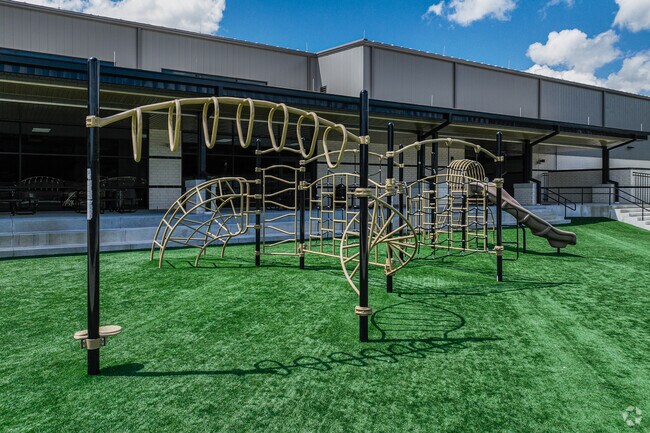 John Colbert Middle School students can climb and swing on the playground.