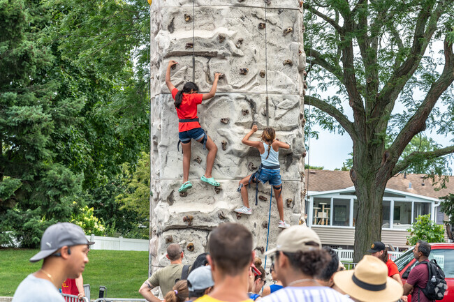 Kids can race their friend up the rock wall at Play, Picnic & Party in Elk Grove Village East.