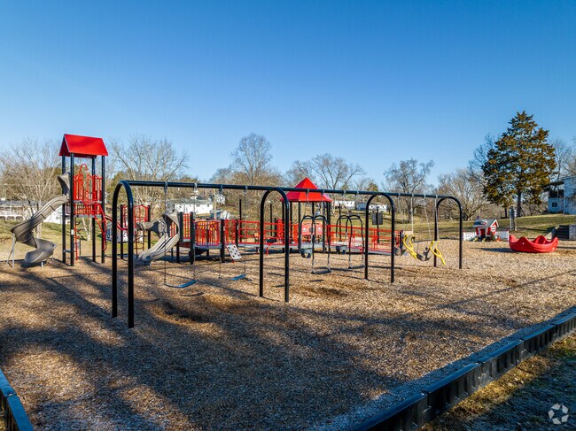 Friendsville, TN has a red-trimmed playground for children.