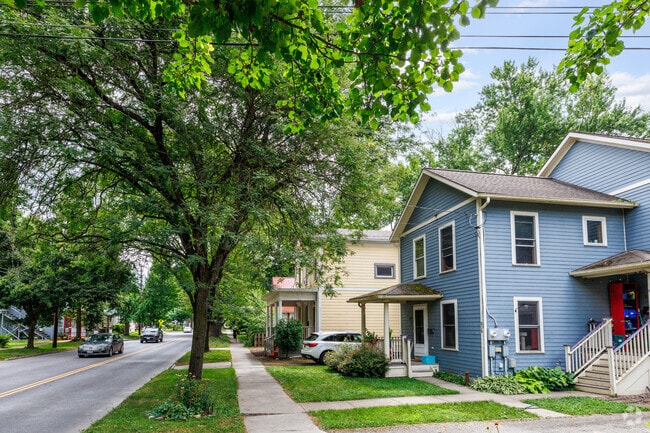 Most homes in South Side Ithaca feature a sidewalk out front and a small driveway on the side.
