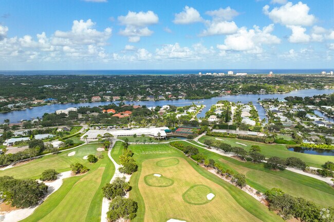 Aerial view of Tequesta Country Club with the ocean and beach in the back.