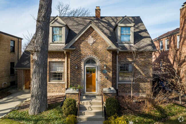 Sauganash homes can range from Tudors and Colonials, to brick Cape Cods like this one.