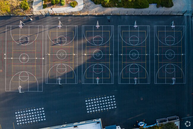 The basketball courts are in the back of Earl Warren Middle School for practice games.