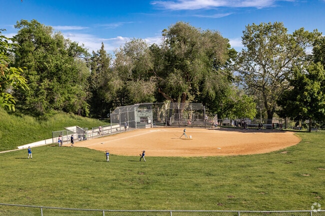 Young players take the field at Lindsey Gardens Park in Salt Lake City.