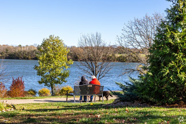 Residents sit and relax on benches throughout the Shawnee Lake area.