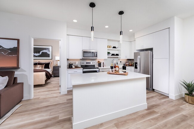 Kitchen with prep island and light wood style flooring