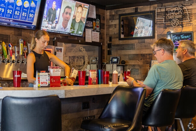 Grab a cold one at Industrial Bar & Grill near Crescent Oaks.