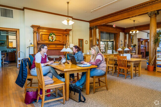 People utilize the free wifi at the Aldrich Public Library near Graniteville.